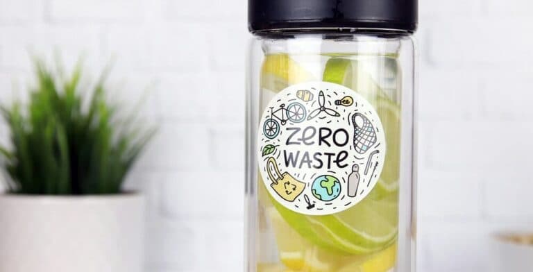 Reusable bottle with a zero waste sticker filled with fruit-infused water
