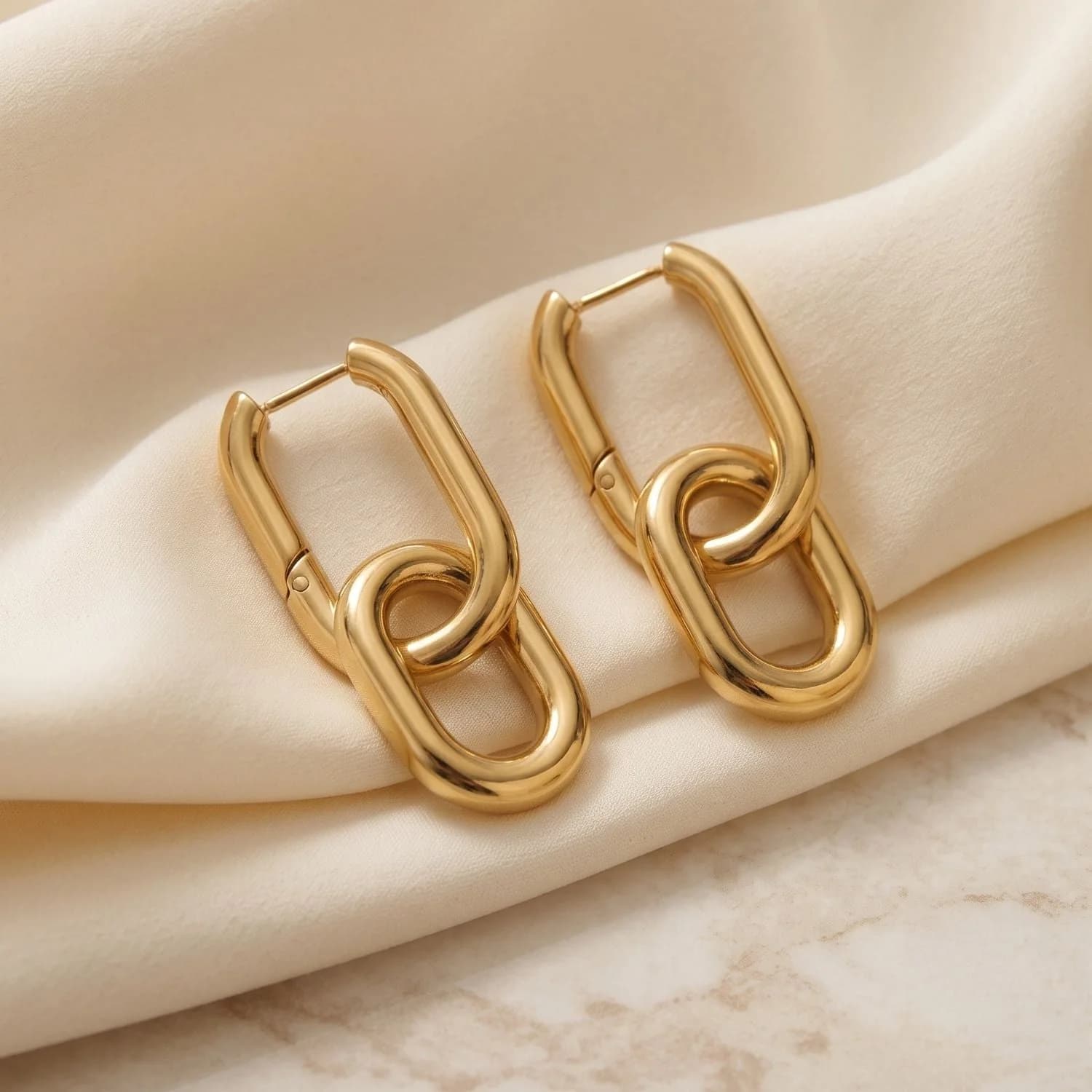 Gold convertible paperclip drop earrings with a removable link