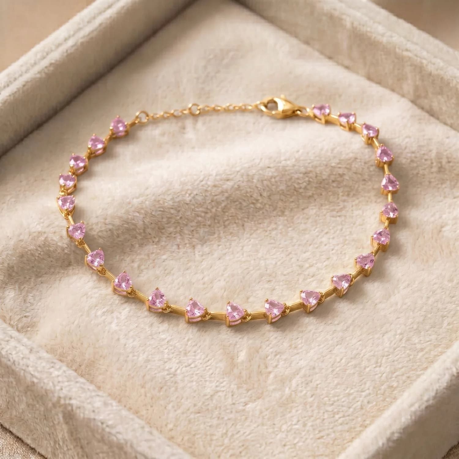 Pink tourmaline CZ October birthstone heart tennis bracelet in rhodium plated sterling silver, another angle