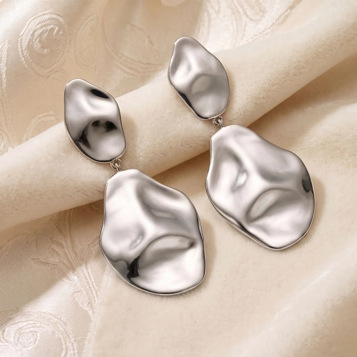 Hammered teardrop dangle earrings in PVD silver plated stainless steel, another angle