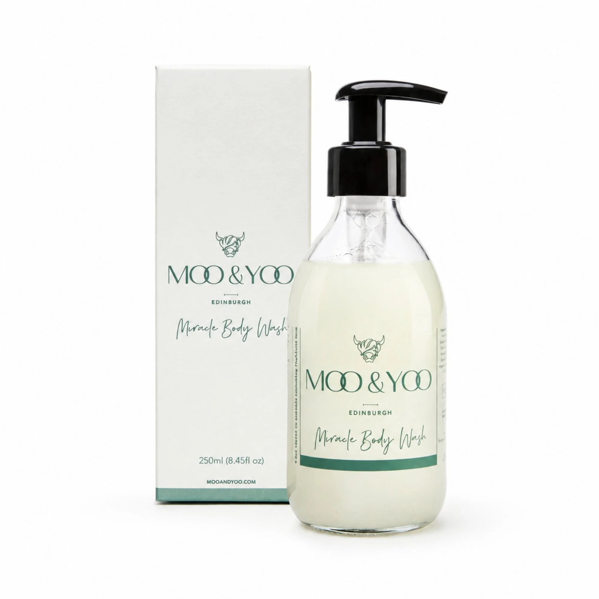 Moo & Yoo Edinburgh Miracle Body Wash in a clear bottle with a black pump dispenser, shown next to its white packaging box on a white background.